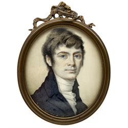 19th century oval portrait miniature, watercolour on ivory of a young gentleman wearing a blue coat 5.5cm x 4.5cm. This item has been registered for sale under Section 10 of the APHA Ivory Act