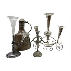 Early 20th century silver-plated five trumpet table epergne, Walker & Hall silver plated epergne with two glass trumpets, Egyptian beaten copper ewer, the handle inscribed Tahta and a three branch candelabra (4)