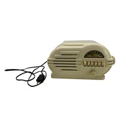 Belmont 'The Rabbit' bakelite radio, model 6D111, circa 1946, cream ivory bakelite case with push buttons, with an manufacturers label to the underside, W32cm x H19cm 
