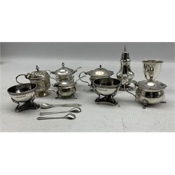 Pair of Victorian silver circular salts on claw and ball feet and triangular base Birmingham 1885 Maker Hilliard and Thomason, five silver circular mustard pots, various dates, silver pepperette and an egg cup 15oz 