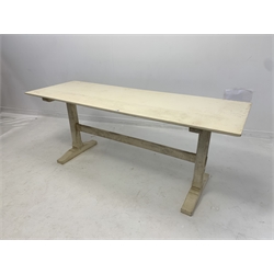 20th century Arts and Crafts white painted oak refectory style dining table, rectangular top with chamfered edge raised on square chamfered supports terminating in sledge feet, united by tenon stretcher 