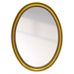 Victorian design gilt framed wall hanging mirror, moulded oval frame with beaded slip, plain mirror plate 
Provenance: From the Estate of the late Dowager Lady St Oswald