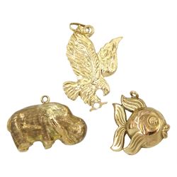 14ct gold eagle charm and two 9ct gold hippopotamus and fish charms