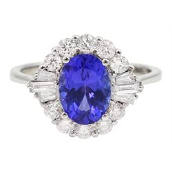 18ct white gold oval tanzanite, round and baguette cut diamond cluster ring, stamped 750, tanzanite approx 1.55 carat, total diamond weight approx 0.60 carat