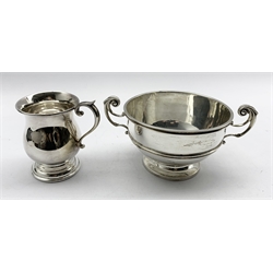 Late Victorian silver two handled trophy inscribed 'Walking Foxhound Puppy' presented by Earl Manvers D10cm London 1900 Maker Goldsmiths and Silversmiths Co and a small silver christening mug Sheffield 1956 10.6oz