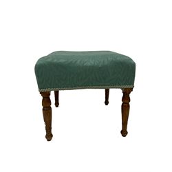 Late Victorian mahogany framed tub chair, the open back and arms upholstered in floral blue fabric, raised on turned supports, together with a similar footstool 