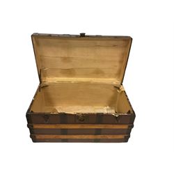 Early 20th century wood and metal bound traveling trunk (W77cm D42cm H40cm); and a small black painted metal trunk or box with twin handles and hinged top (W51cm D38cm H33cm)