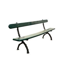 Victorian railway garden bench, the single plank back and seat raised on cast metal supports of naturalistic form L220cm