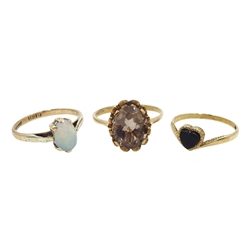 Gold single opal ring, gold jet heart shaped ring and a gold smoky quartz ring, all hallmarked 9ct