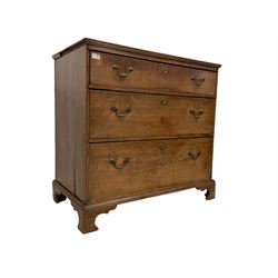 Early George III oak straight-front chest, rectangular top with moulded edge, fitted with three graduating drawers, raised on bracket feet