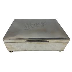 Edwardian silver rectangular playing card box, the hinged lid engraved 'Bridge' with divided interior and on ball feet 15cm x 11cm Chester 1902 Maker William Neale & Sons