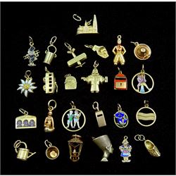 Twenty five 14ct gold charms including bus, lantern, aeroplane, enamel figures, all stamped or tested, approx 24.3gm