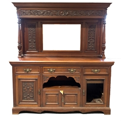 Large late Victorian mahogany mirror back sideboard, dentil cornice over floral carved frieze, bevelled mirror and turned fluted and lobe carved supports, three drawers and three cupboards under