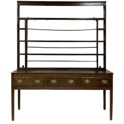 18th century oak dresser with three height plate rack, three frieze drawers with mahogany cross-bands, raised on square tapering supports 