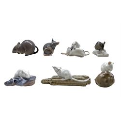Six Royal Copenhagen porcelain mice comprising Mouse on Sugar no. 510, Mouse on Chestnut no. 511, Mouse on Corncob no. 512, Mouse on Fish Head no. 513, all designed by Erik Nielsen, Field Mouse no. 2564 and a Bing & Grondahl mouse no.1801 (7)