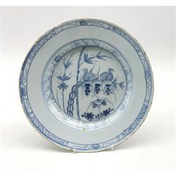18th century Delft tin-glazed plate decorated with Squirrels feeding on fruiting vine amidst bamboo and foliage within geometric border, numbered '5'' beneath, D27cm 