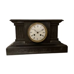 French - Belgium slate 19th century 8-day striking mantle clock, case with a flat top on a broad plinth and volute columns to the front, enamel dial with Roman numerals and moon hands within a cast brass bezel. Striking the hours and half hours on a bell.