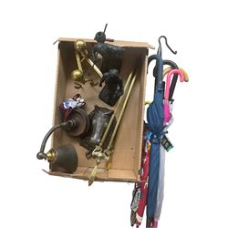 Pair of brass fire dogs, brass fire companion set of two, horse door knocker, metal lamp, two metal figures and quantity of umbrellas in one box