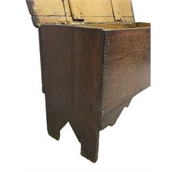 17th/18th century boarded or plank chest, hinged lid enclosing candle box, with incised edge decoration, on bracket end supports 