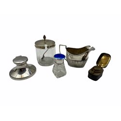 Silver circular inkwell London 1924, silver cream jug, glass scent bottle with silver and enamel cover, glass and silver preserve jar and a small travelling inkwell