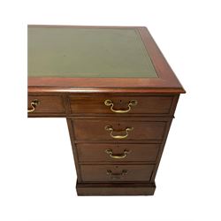 20th century Georgian design mahogany twin pedestal desk, moulded rectangular top with leather inset, fitted with seven drawers, on moulded plinth base