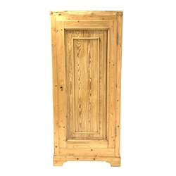 Large pine cupboard, with single fielded panelled door enclosing a shelf, raised on bracket supports, W90cm, H205cm, D48cm