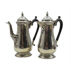 Silver coffee pot and matching hot water jug of baluster design with domed covers and ebonised handles H20cm Sheffield 1944 Maker Harrison Bros. & Howson 28.4oz gross 