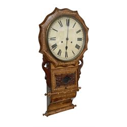 American -  late 19th century wall clock with an octagonal dial surround and parquetry work to the case, with carved side pieces, pendulum viewing door and an ogee base, painted dial with Roman numerals and minute track, twin train spring driven movement, striking the hours on a coiled gong. With pendulum.