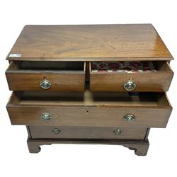 George III mahogany chest, moulded rectangular top over two short and three long drawers, circular pressed brass handle plates, on bracket feet