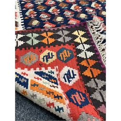 Large kilim ground carpet, the blue field with repeating geometric motif, enclosed by three borders 484cm x 197cm