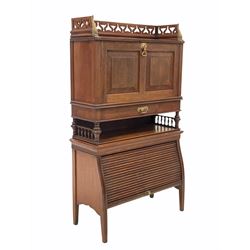 Early 20th century mahogany bureau, the raised and pierced top with brass mounts over two panel fall front with fitted interior, drawer and open shelf, tambour cupboard to base, raised on square tapered supports 