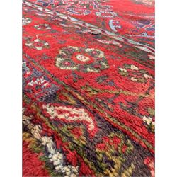 Large Red Ground Turkey carpet, decorated with a formal floral design 482cm x 421cm