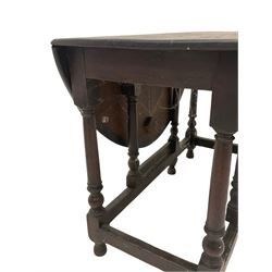 18th century oak gate leg table, the oval top with two drop leaves raised on turned and block supports united by stretcher W95cm