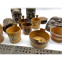 Mauchline ware butter tubs and salt cellars decorated with views and portraits including Robert Burns, Burns Monument, Gloucester Cathedral etc together with a selection of early 20th century and later carved treen including a Cribbage board, busts etc 