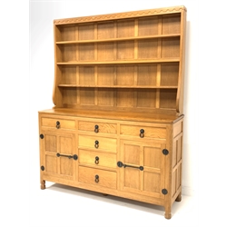 'Mouseman' 5' adzed oak dresser, three height plate rack over base fitted with six drawers, two cupboards enclosing shelves, raised on turned octagonal supports, W153cm, H195cm, D47cm