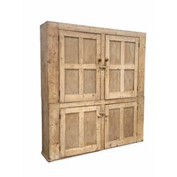 Large late 19th century stripped pine housekeepers cupboard, with four panelled doors enclosing shelves, W183cm H203cm, D37cm