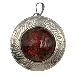 Modern silver pendant, of circular form with central red enamel domed plaque, within an engraved silver border, hallmarked Jon Braganza, London 2018, D4.5cm