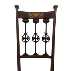 Possibly Liberty's of London - set of four late 19th century Art Nouveau chairs, the cresting rail inlaid with heart motifs and extending leaves in metal, three upright splats carved as stylised tulip flowers, floral needlework upholstered seats, on square supports with compressed splayed feet