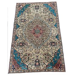 Persian design fawn ground rug, floral medallion and field with colourful spandrels, guarded border 288cm x 178cm