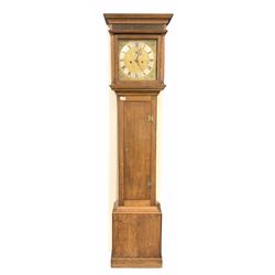 An oak longcase with a step topped hood, deep concave moulding and blind fretted frieze to front, square glazed hood door with wooden pillars and capitals attached, Oak trunk with a full length flat topped door on a skirted plinth, 11