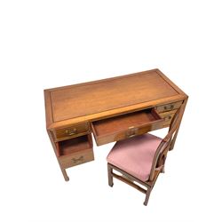Hong Kong rosewood writing desk, the rectangular top over five drawers, raised on square supports (W122cm, H78cm, D56cm) together with a chair of similar design 