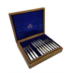 Set of eleven silver bladed dessert knives and twelve forks with mother of pearl handles in original oak case Sheffield 1912 Maker Mappin and Webb