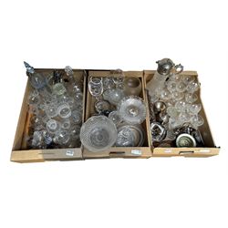 Quantity of glassware including a large moulded glass claret jug, drinking glasses, paperweights, candlesticks, together with silver-plated cutlery, bowls, coaster etc in three boxes