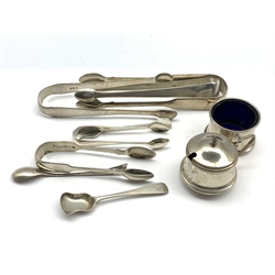 Two pairs of early 19th Century silver sugar tongs, pair of William IV silver fiddle pattern tongs, two others, three condiment spoons, silver mustard pot and silver salt  
7oz