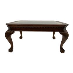 Mahogany coffee table, canted rectangular top with glass inset, the frieze with dentil decoration, on acanthus carved cabriole supports with ball and claw feet