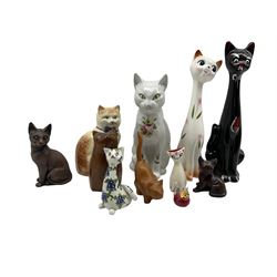 Carved yew wood model of a cat by John Fox H16cm, Wade and other ceramic cat ornaments and two resin cats