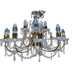 20th century Italian gilt metal eighteen-light chandelier, central gilt metal and glass column terminating twelve scroll arms over two tiers, suspended with faceted glass chains and prism drops throughout, H53cm (excluding fitting) W75cm approx