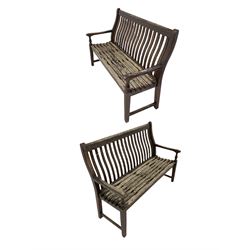 Pair of wooden garden benches, the slat back and seat raised on squared supports W H D 