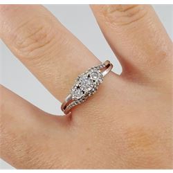 9ct white gold three stone round brilliant cut diamond ring, with pierced diamond set gallery, hallmarked, total diamond weight 0.25 carat