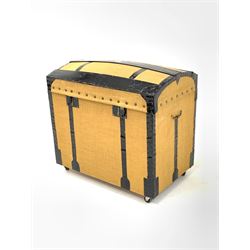 Early 20th century wood and metal bound dome top travelling trunk, having been recovered in hessian, the interior lined with blue silk, raised on castors, W81cm, H76cm, D52cm
